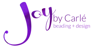 Logo for Joy By Carlé website - a swirly, script in the font Levitee for the word 'Joy' and the sans serif font Lato Light for 'by Carlé' and 'beading + design. The text fill colors are vibrant, rich, saturated purple variations of a space-like design, giving the logo a bit of depth, texture, and tonal variation.